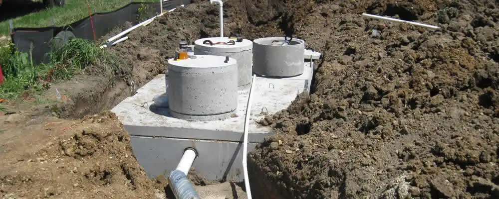 Septic system repair and installation site with tank access ports in San Diego, CA